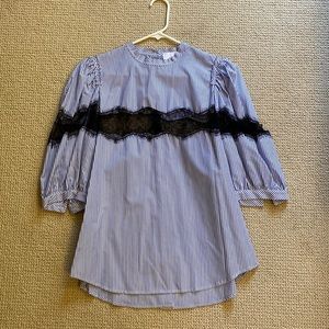 Thin stripe with lace inset, buttons down back, puff sleeve blouse.